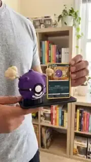 Purple collectible display beside cards
